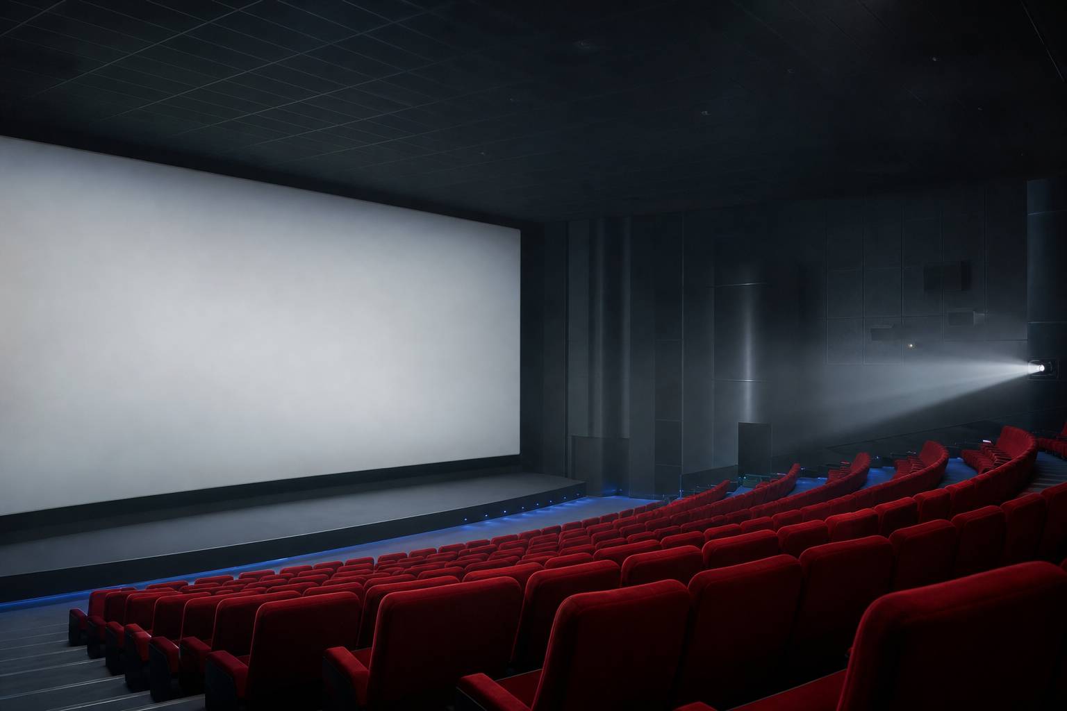 Salle cinema vide ecran fauteuils rouges projecteur